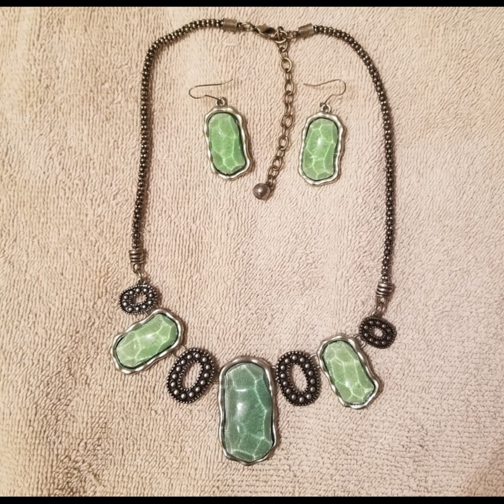 Big heavy aquamarine stones with clear overlay matching earrings.
